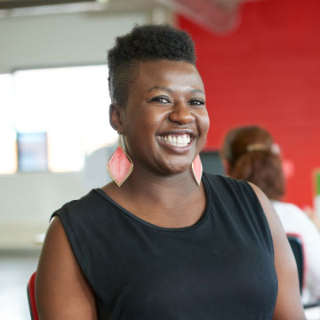 woman smiling staring at the camera